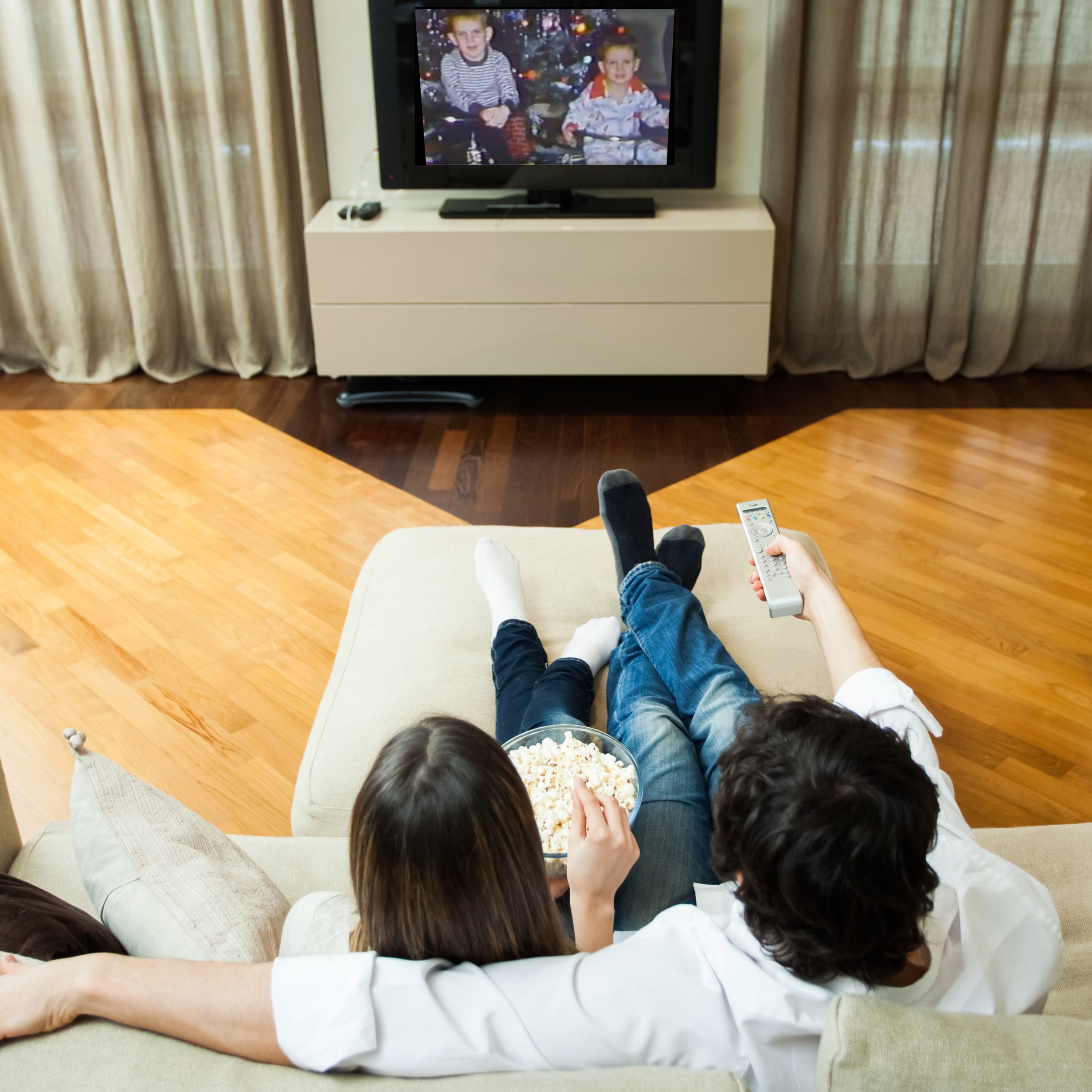 Couple watching home video transfer